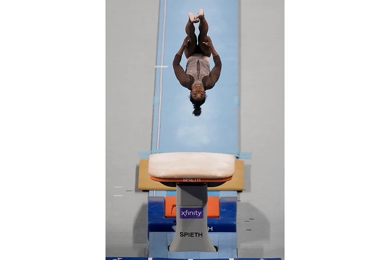Simone Biles competes on the vault 